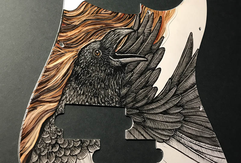 custom guitar pickguard with raven painting