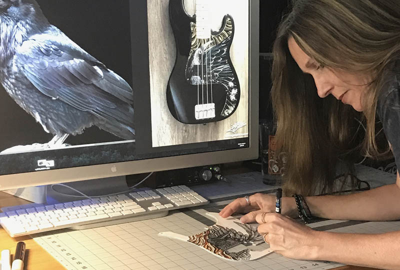 guitar pickguard with raven art